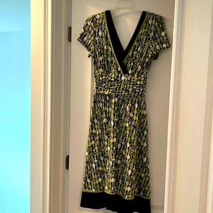 V neck neck knee length dress.  Wore once.  Stretchy polyester material.